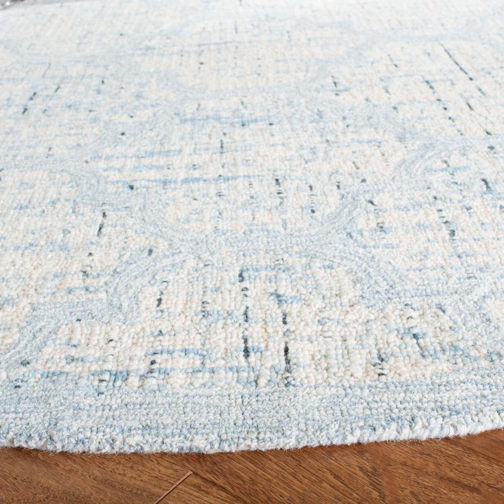 Ivory and Turquoise Round Tufted Wool Area Rug