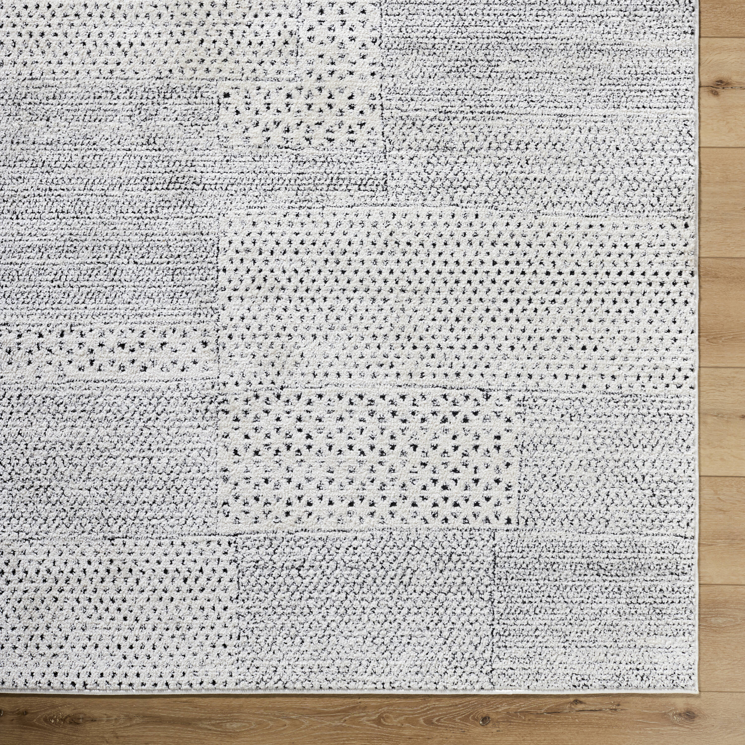 Livabliss 8' x 10' Ivory and Black Synthetic Patchwork Area Rug