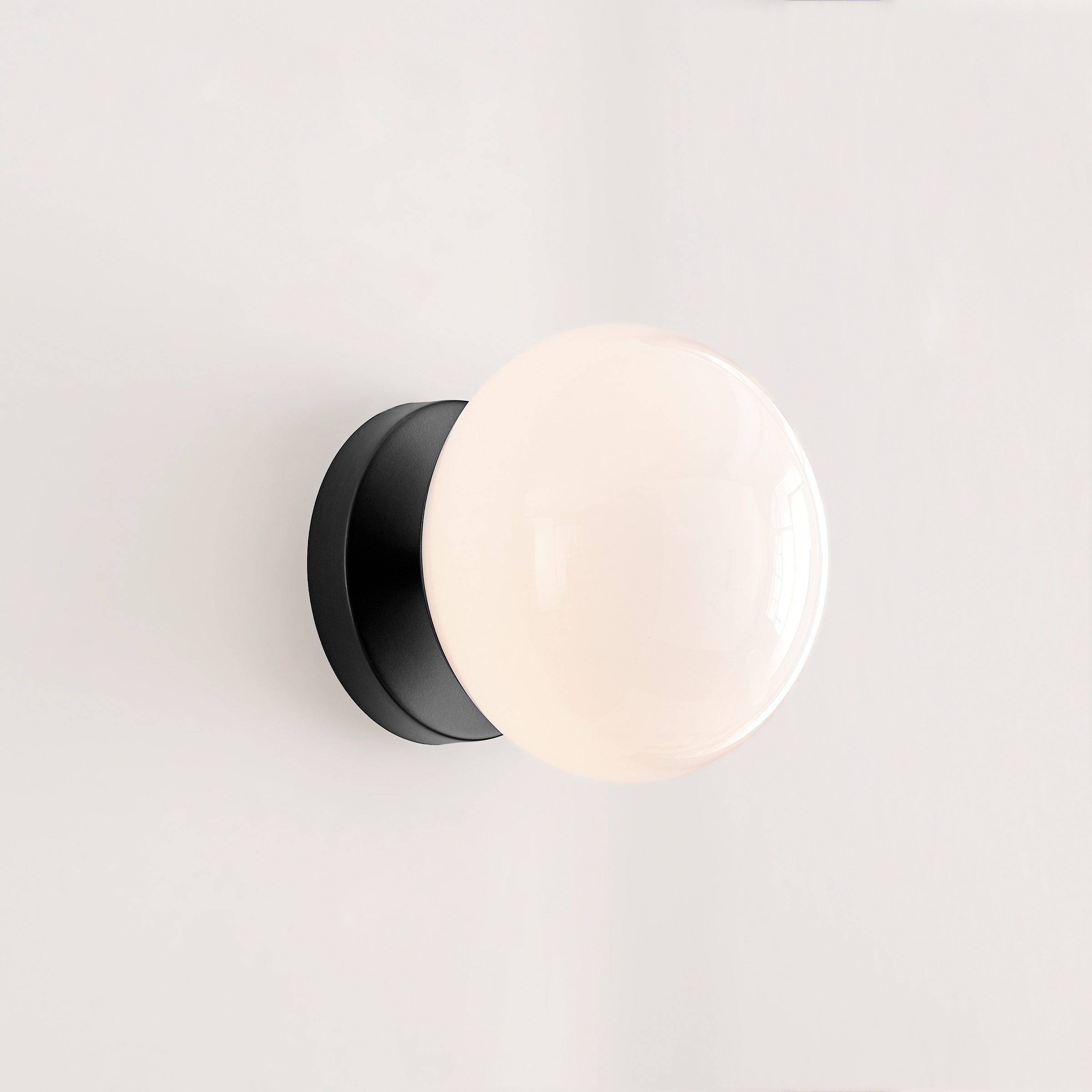 Lune Aged Iron and Milk White Glass Wall Sconce