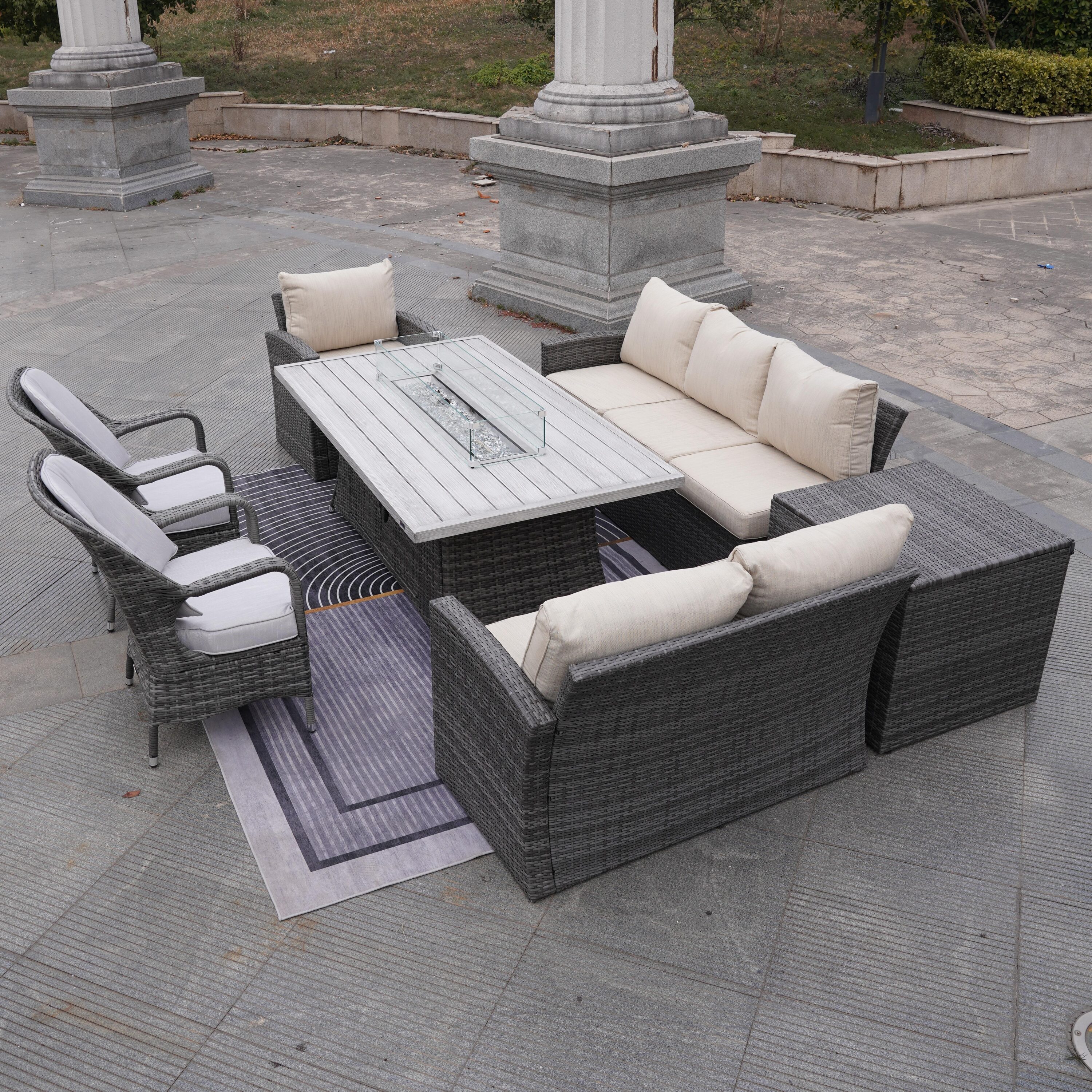 Direct Wicker DWG-1403B06RA009-G 7 -Piece Beige Wicker Patio Dining Set Aluminum Rectangle Table with 2 Beige Cushions Stationary Chairs Fire Pit Included