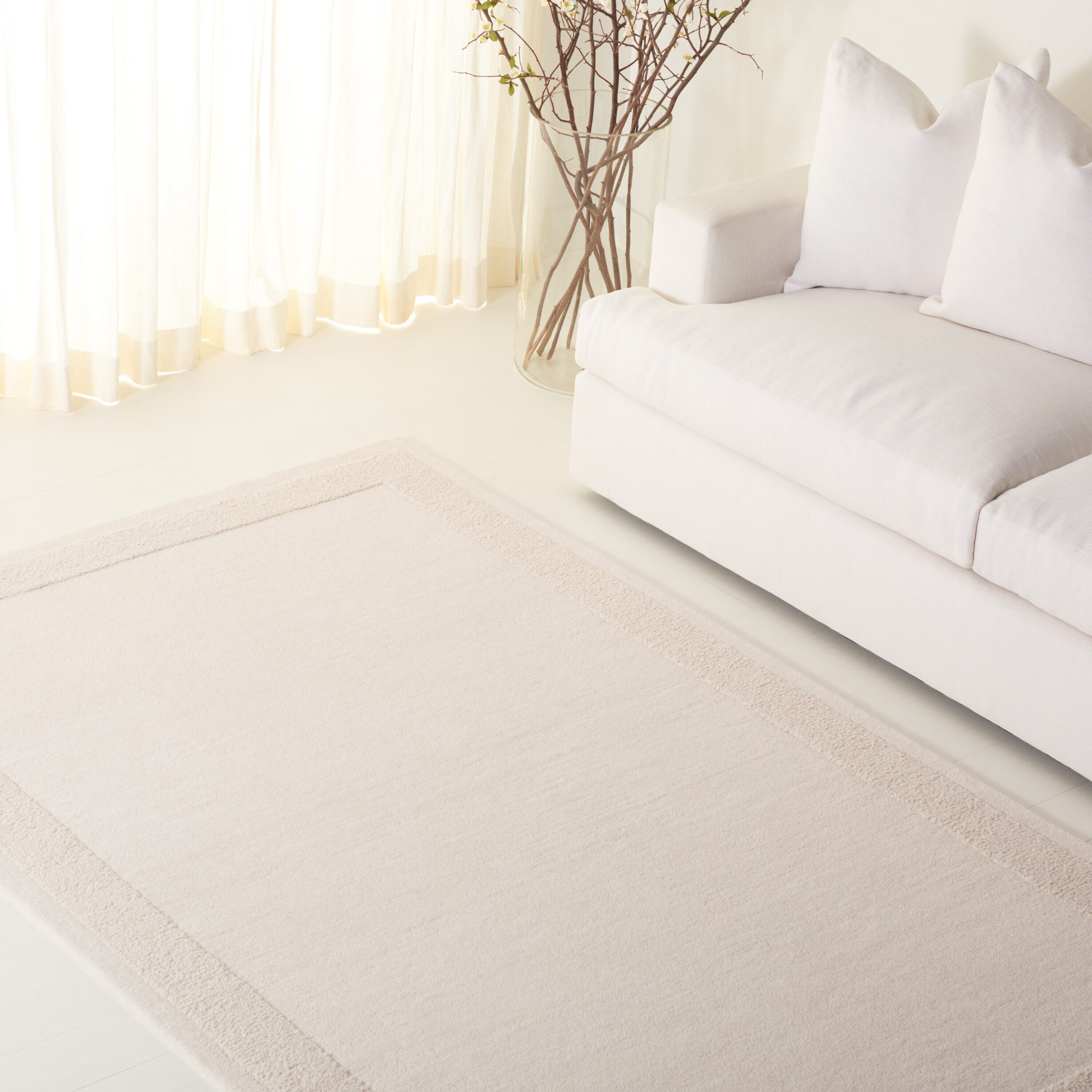 Lauren Ralph Lauren 8 x 10 (ft) Tufted Wool Ivory Rectangular Indoor Solid Spot Clean Only Area rug