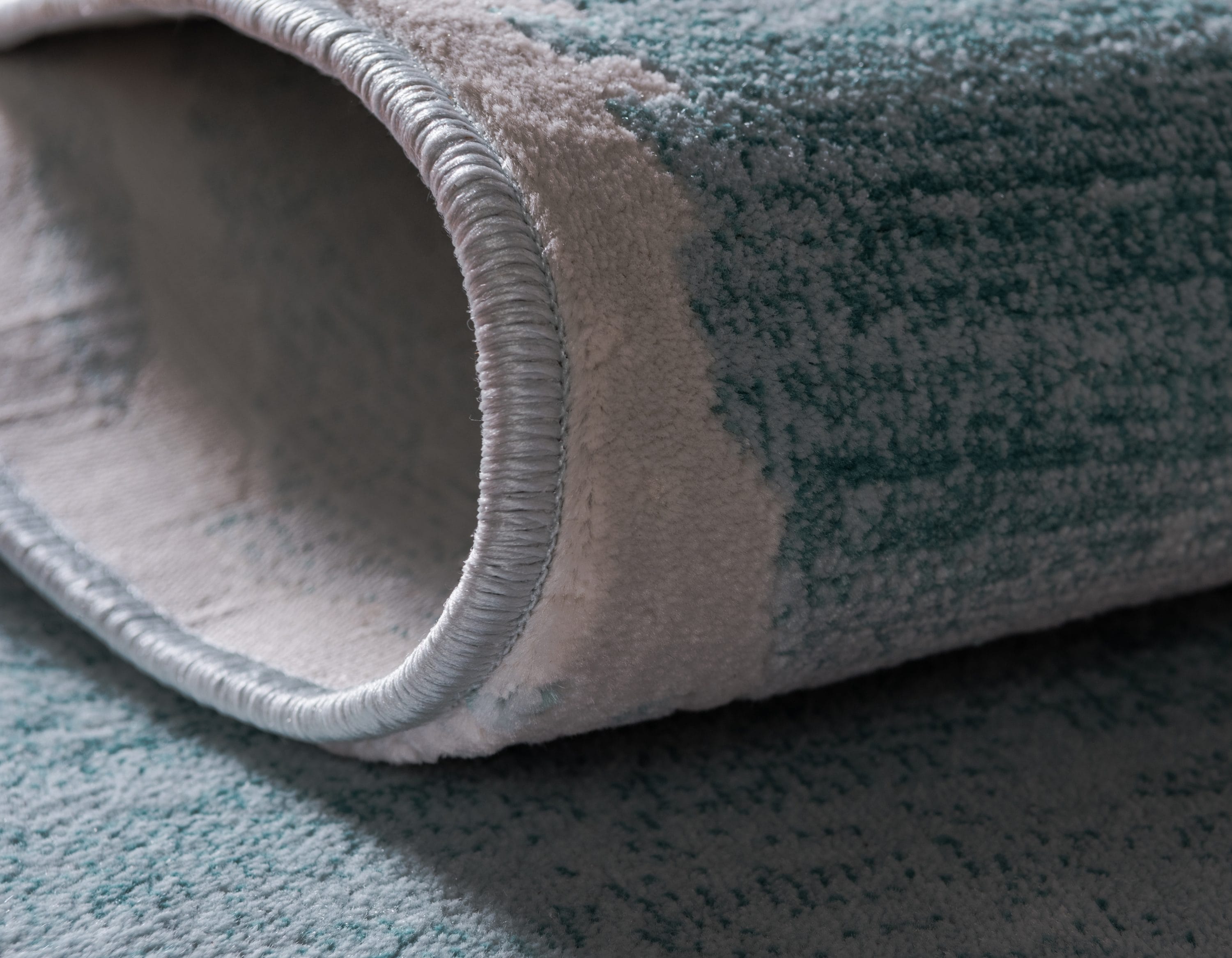 Turquoise and Ivory Rectangular Synthetic Indoor Rug, 5' x 8'