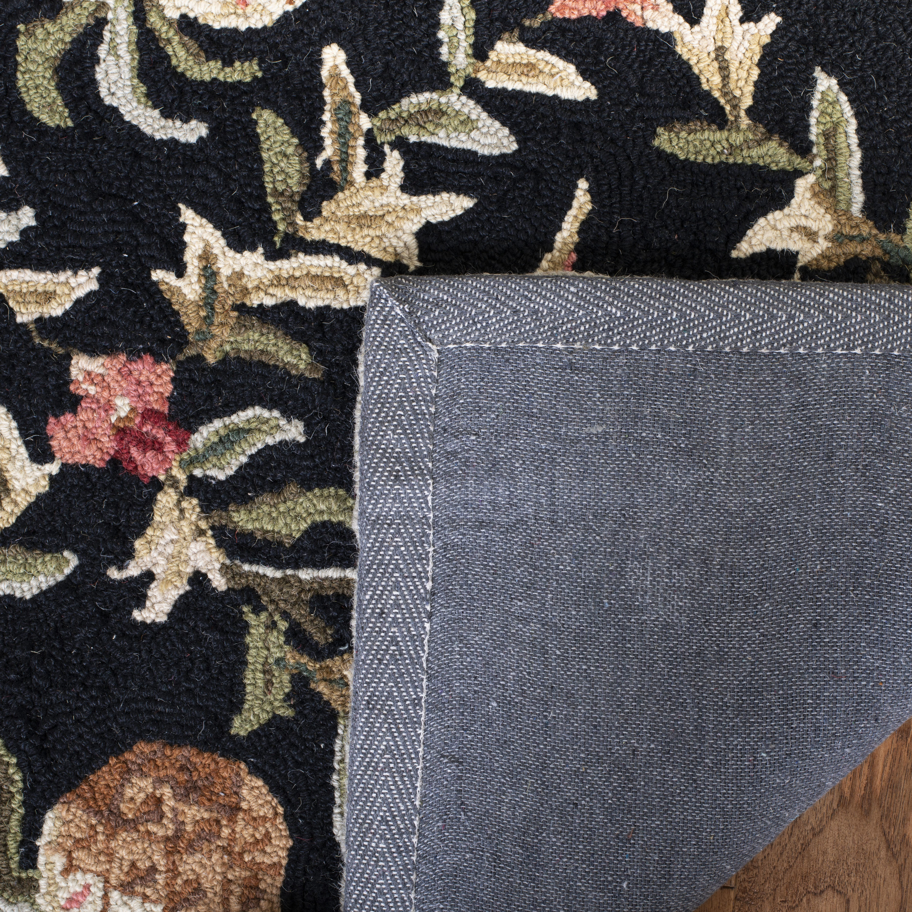 Handmade Ivory and Black Floral Wool Round Area Rug