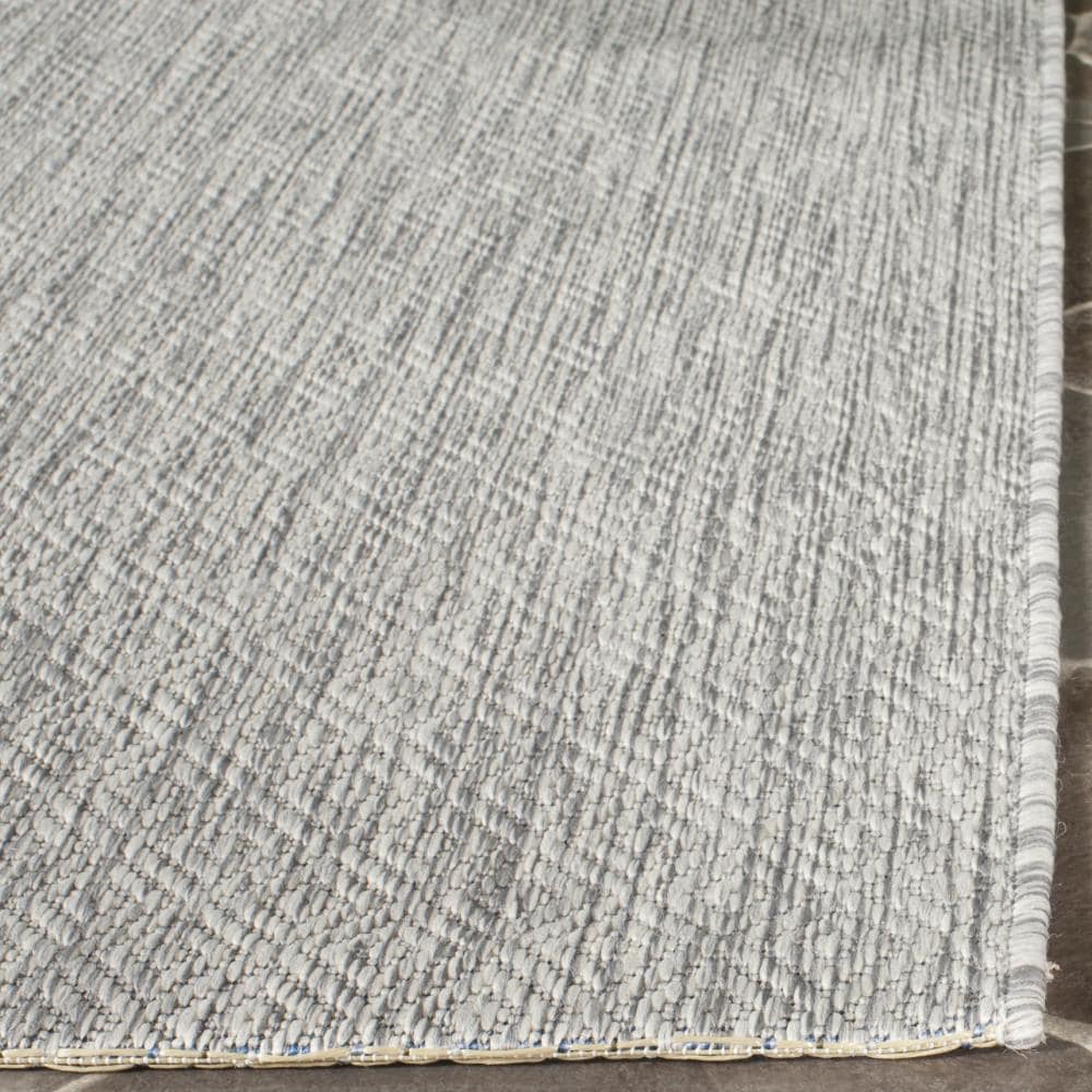 Delano Monochrome Gray Synthetic 6'7" x 9'6" Indoor/Outdoor Rug
