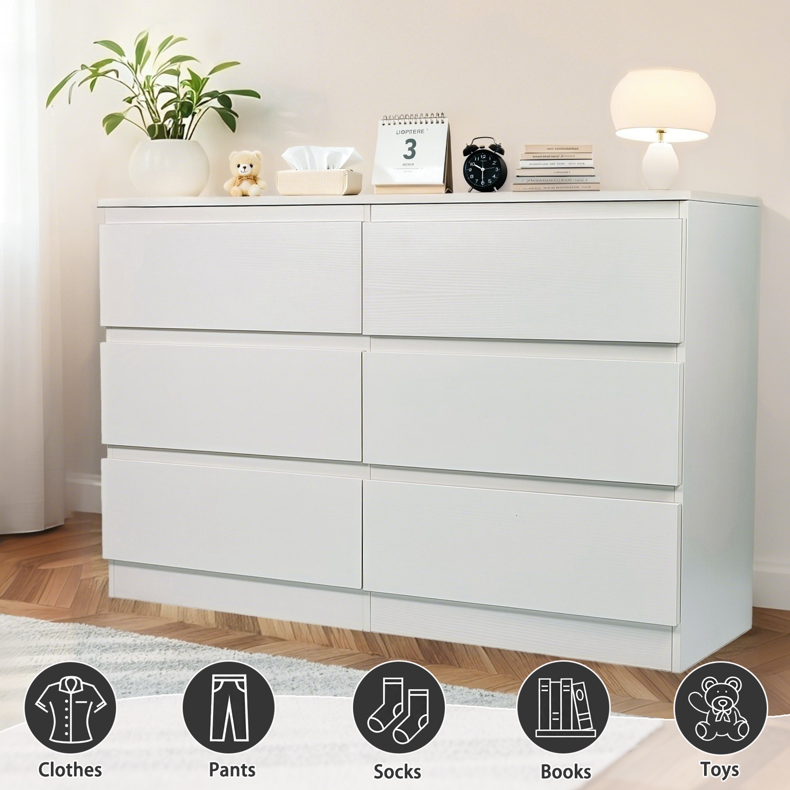 White dresser with six drawers and decorative items on top