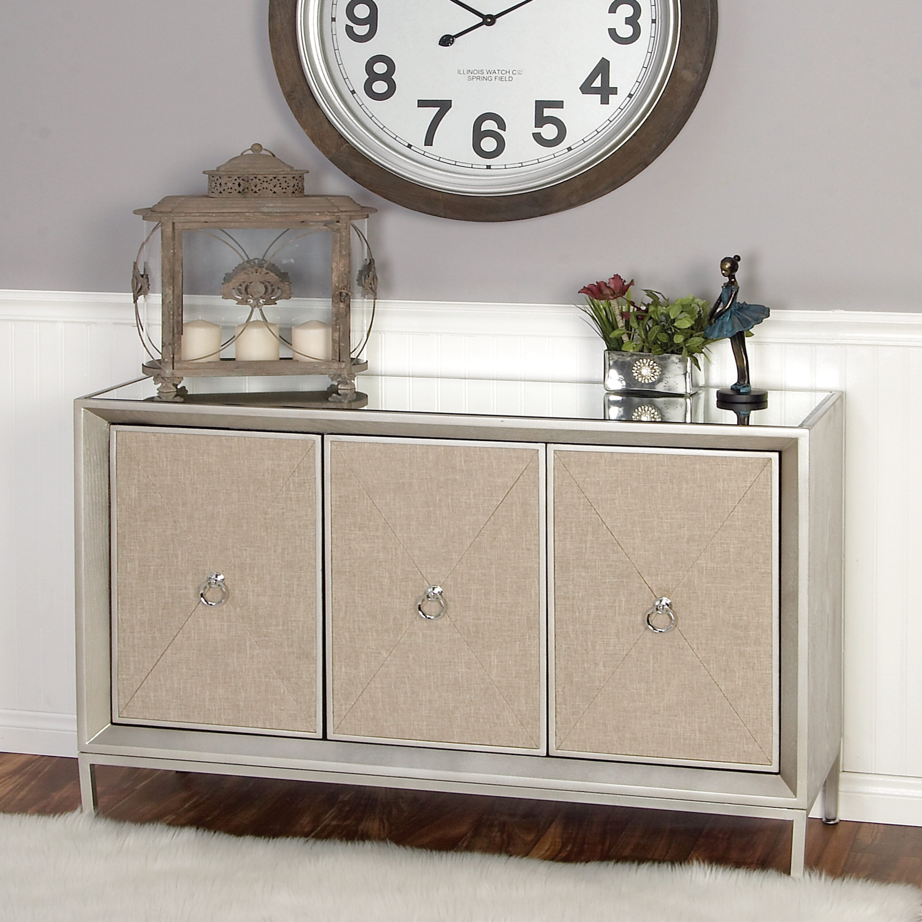 Gray Upholstered 3-Door Cabinet with Mirrored Top and Ring Handles