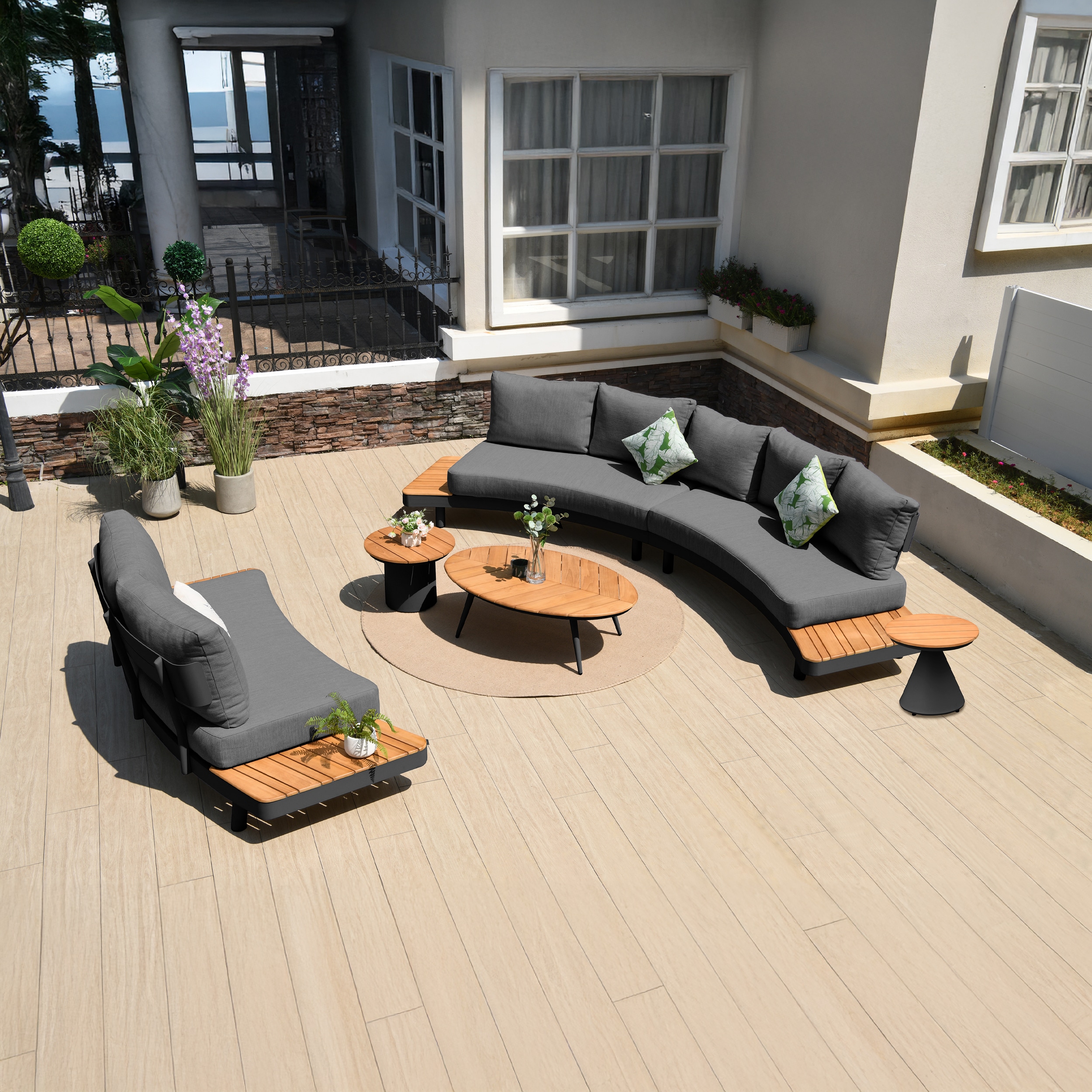 Outdoor living space with gray cushioned sectional set on patio
