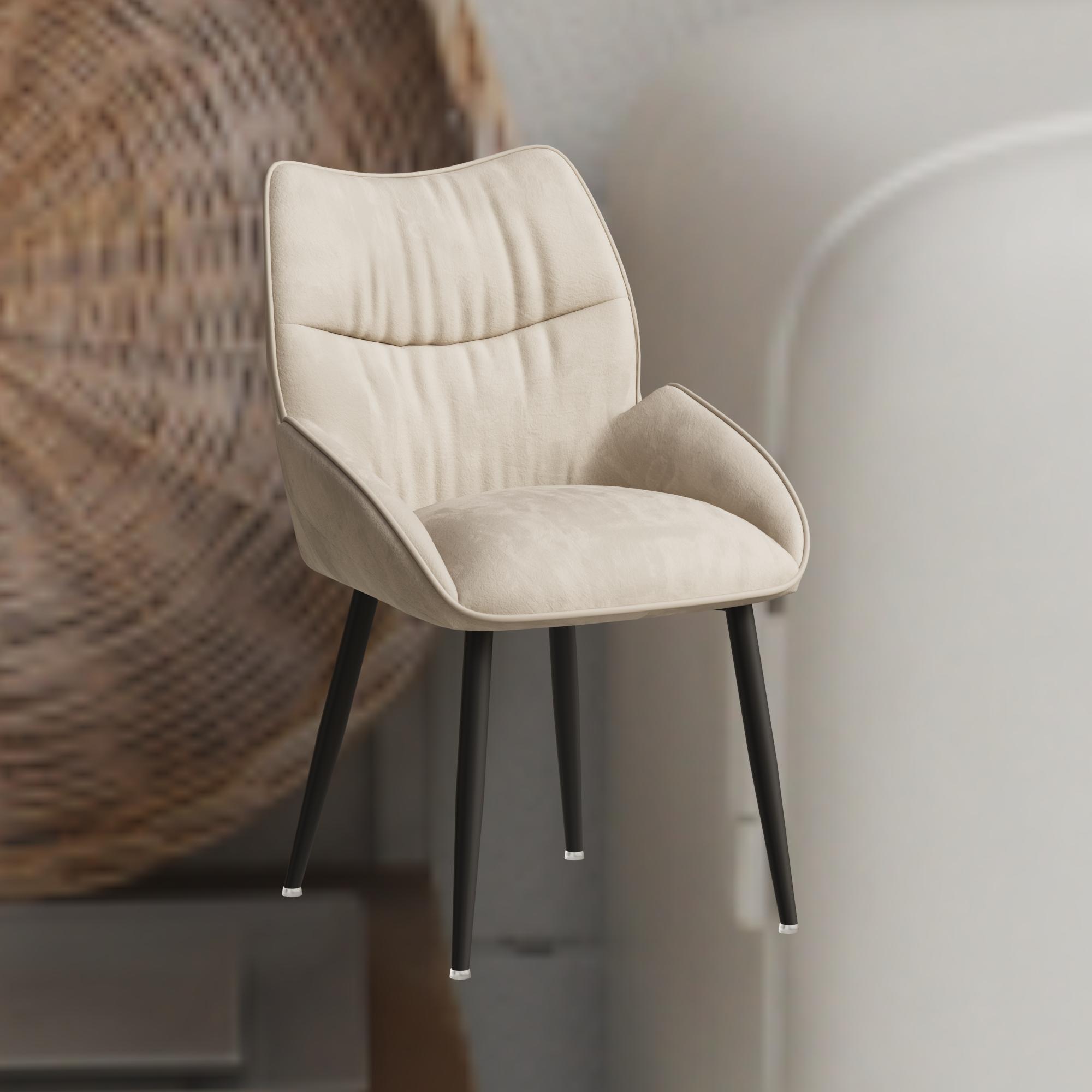 Beige velvet dining chair close-up showing arm and stitching