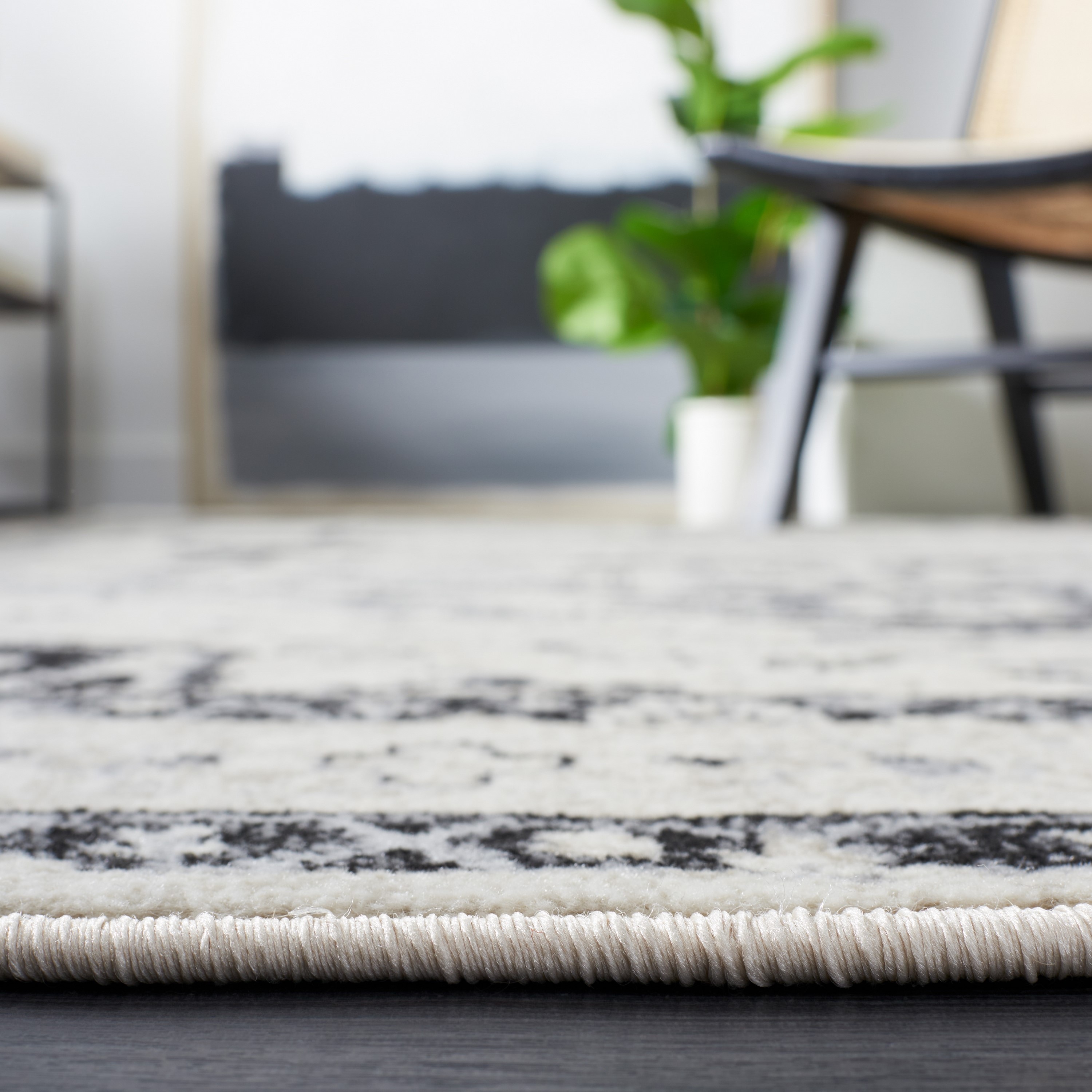Ivory and Black Synthetic Traditional Square Rug, 3' x 5'