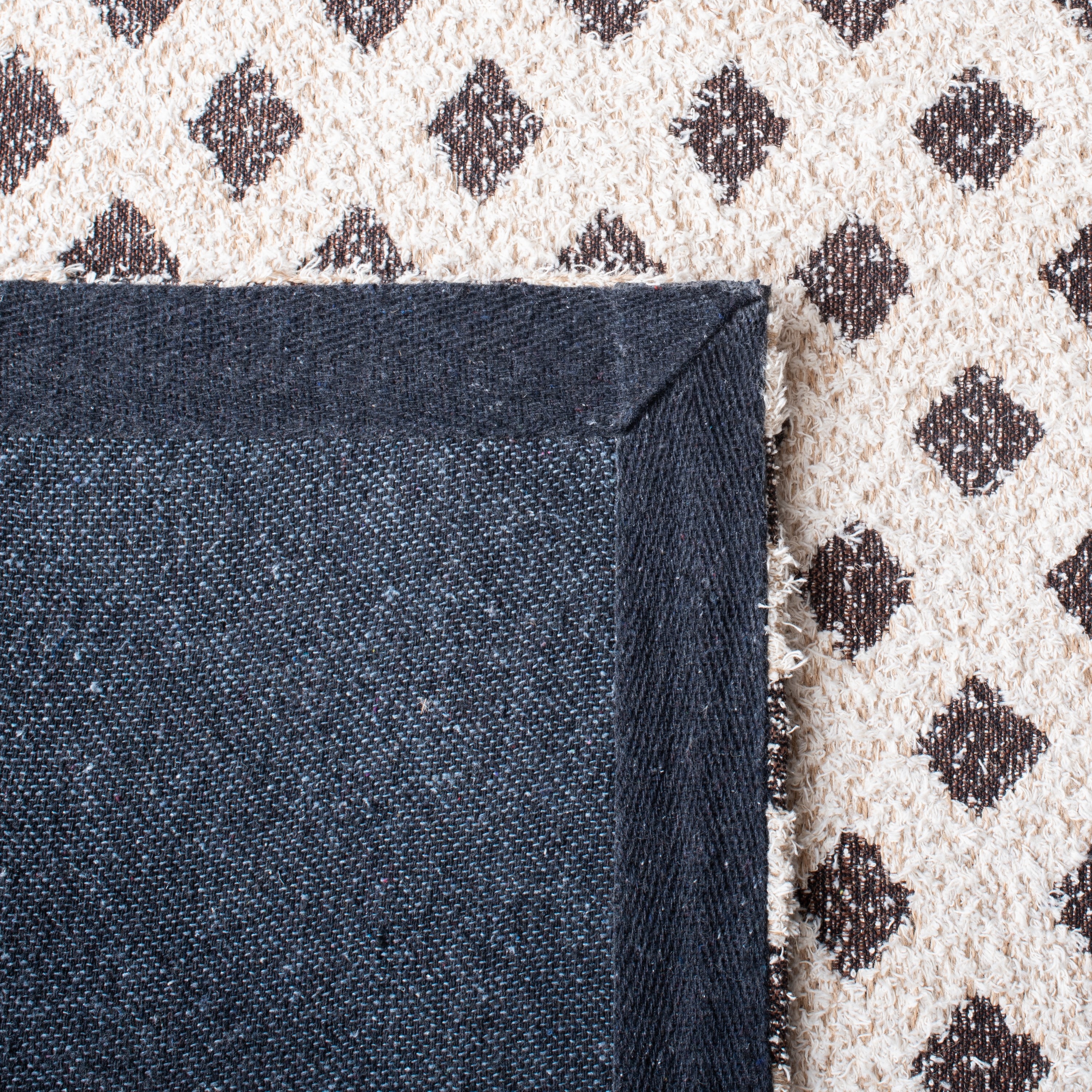 Ivory and Natural 3' x 5' Hand Woven Synthetic Area Rug