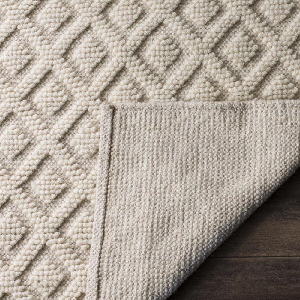 Ivory Handwoven Wool and Synthetic 5' x 8' Area Rug