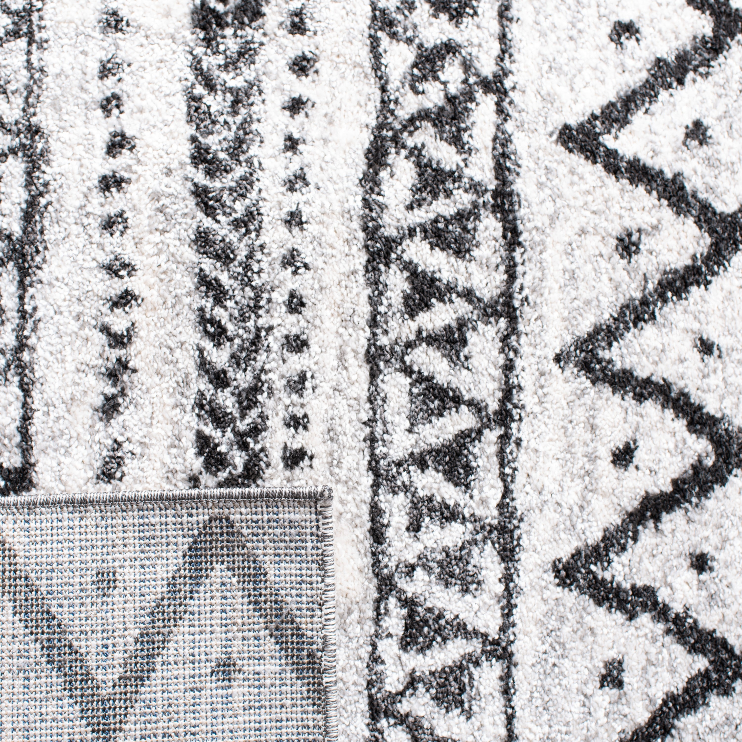 8' x 10' Black and Ivory Geometric Synthetic Area Rug