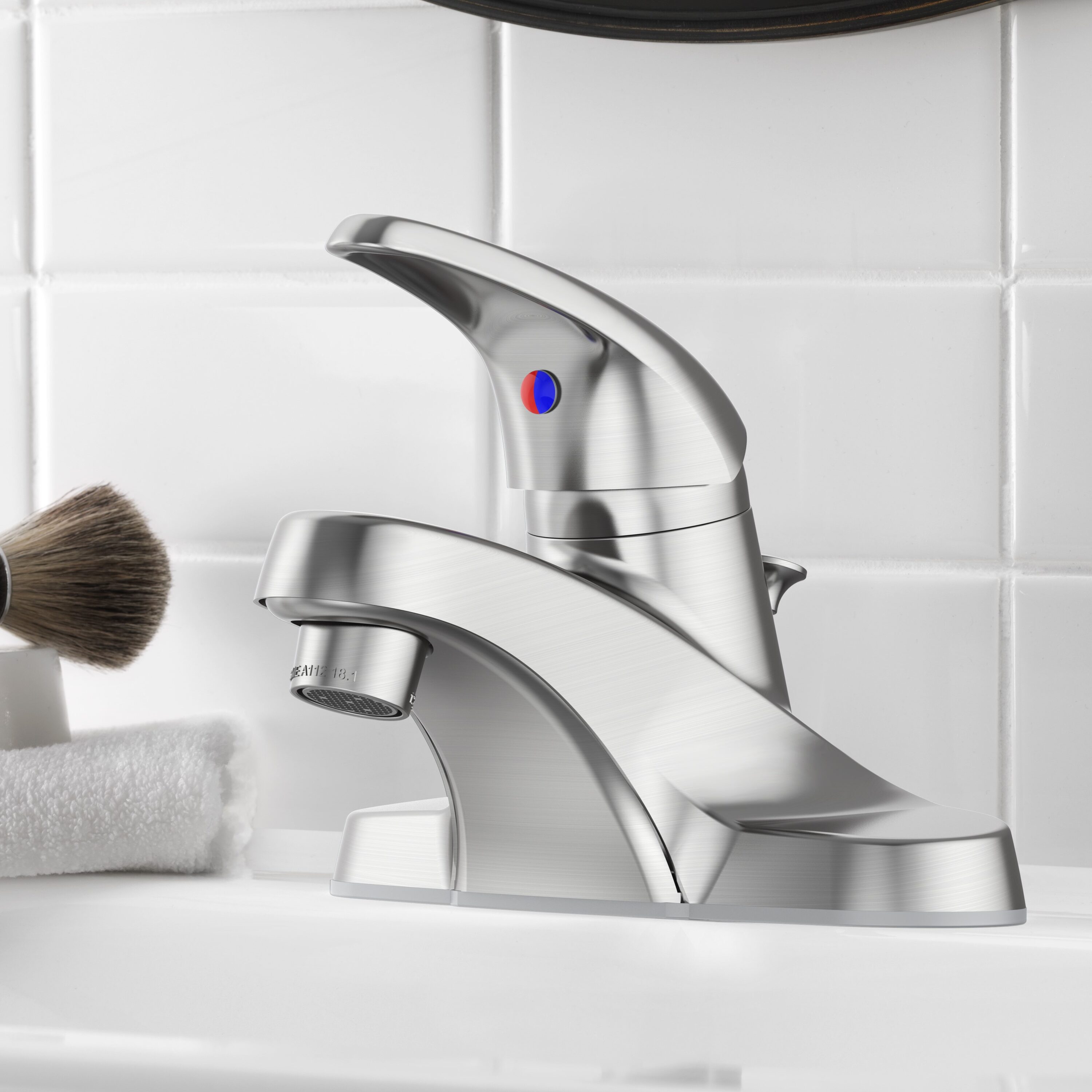 Project Source 67100W-6204 Webber Brushed nickel 4-in centerset 1-handle WaterSense Low-arc Residential Handle Bathroom Sink Faucet with Drain with Deck Plate