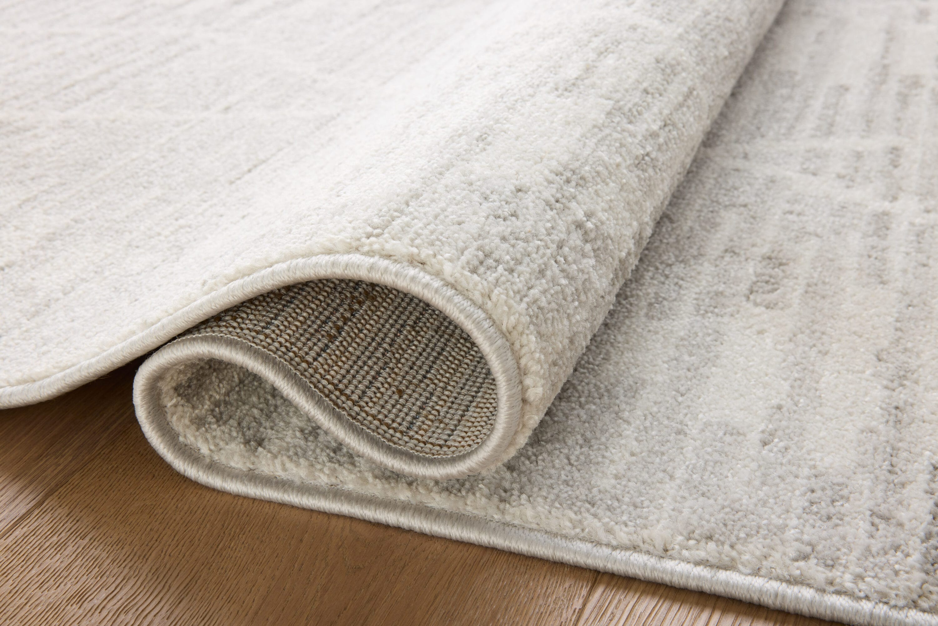 Kamala Ivory and Silver Rectangular Synthetic Area Rug 6'-7" x 9'-6"