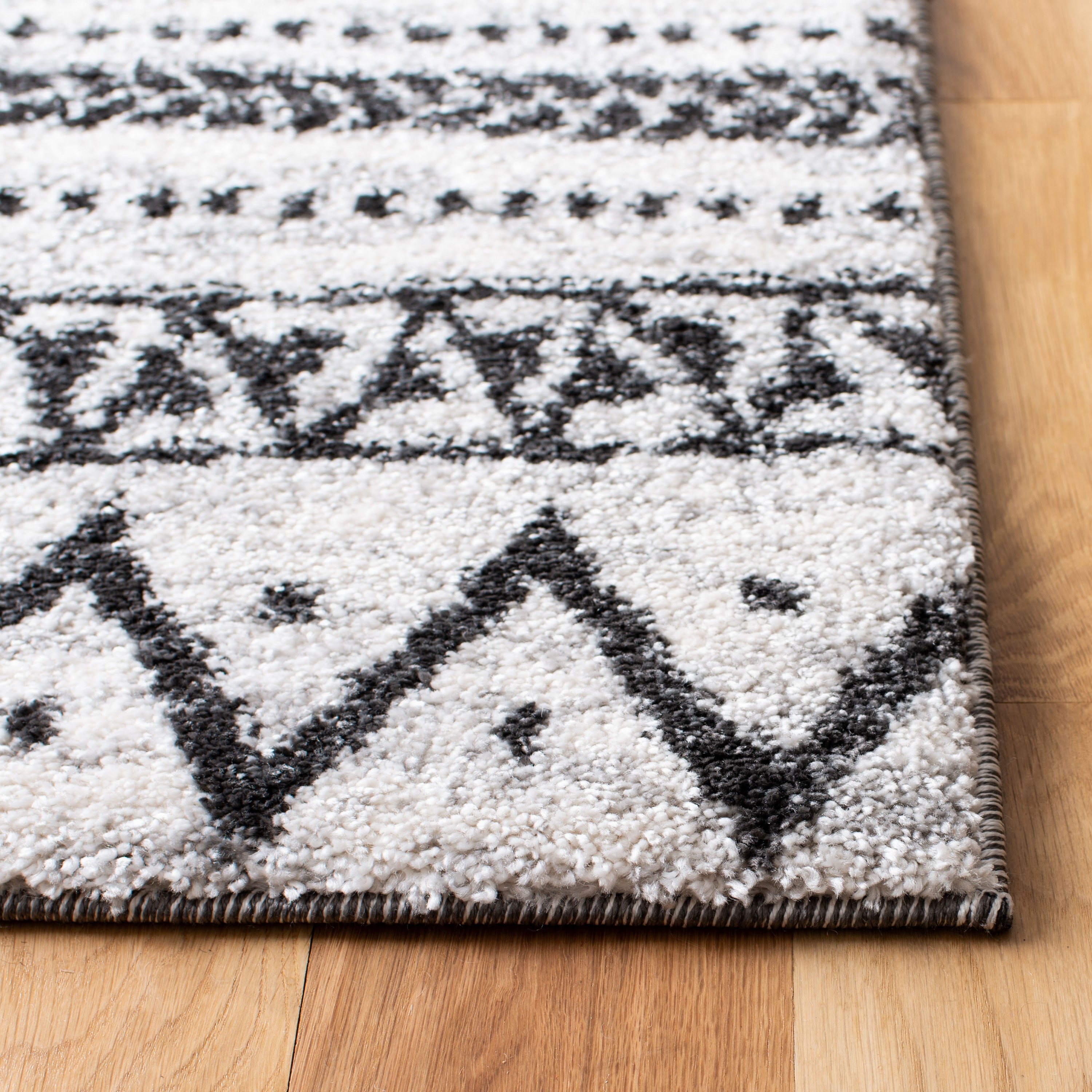 8' x 10' Black and Ivory Geometric Synthetic Area Rug