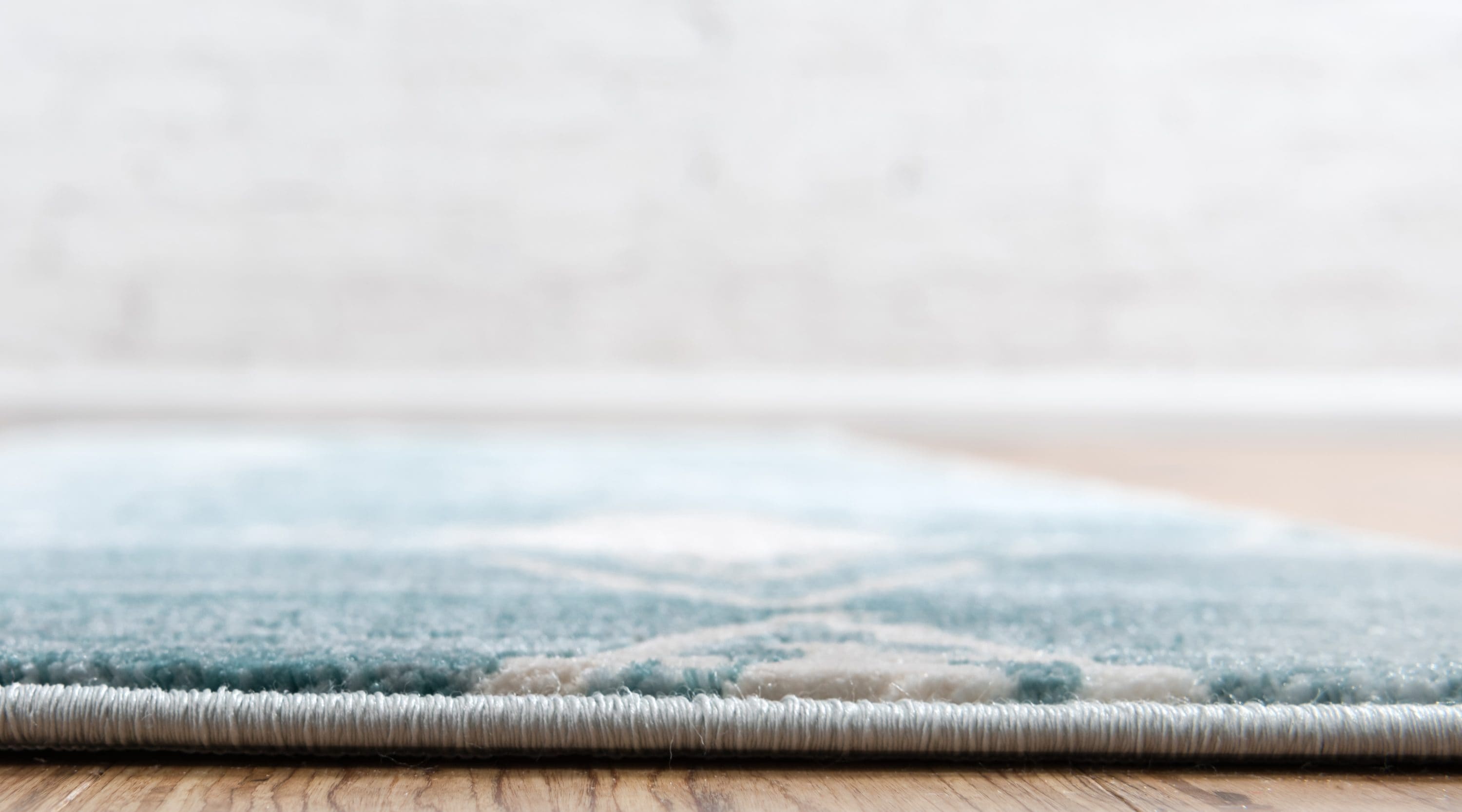 Turquoise and Ivory Rectangular Synthetic Indoor Rug, 5' x 8'