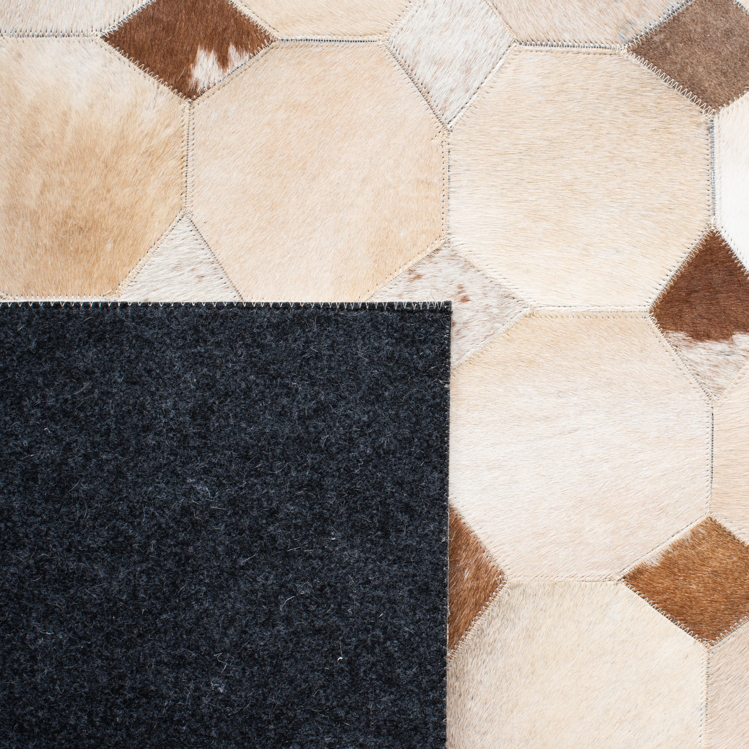Ivory and Brown Geometric Cowhide 4' x 6' Area Rug