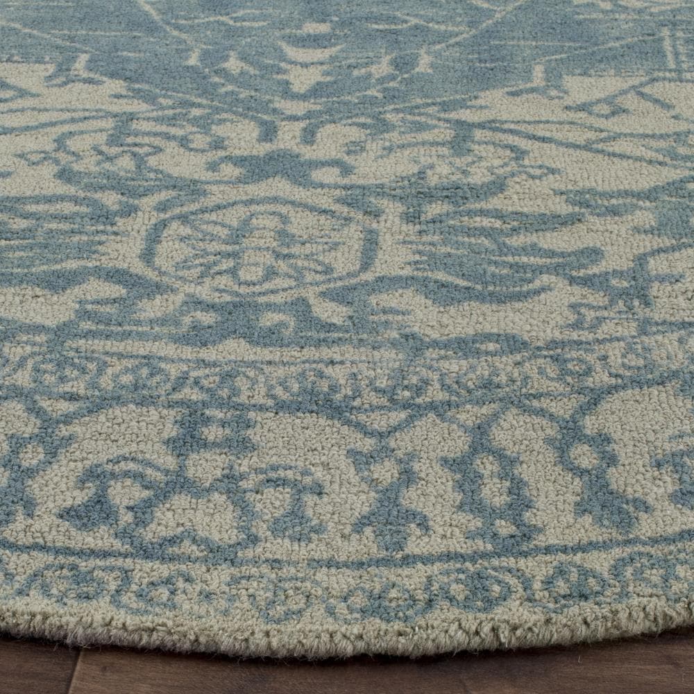 Ivory and Turquoise Round Tufted Wool Area Rug