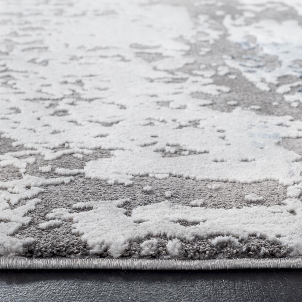 Swirling Greyscale Abstract 59" Round Synthetic Area Rug