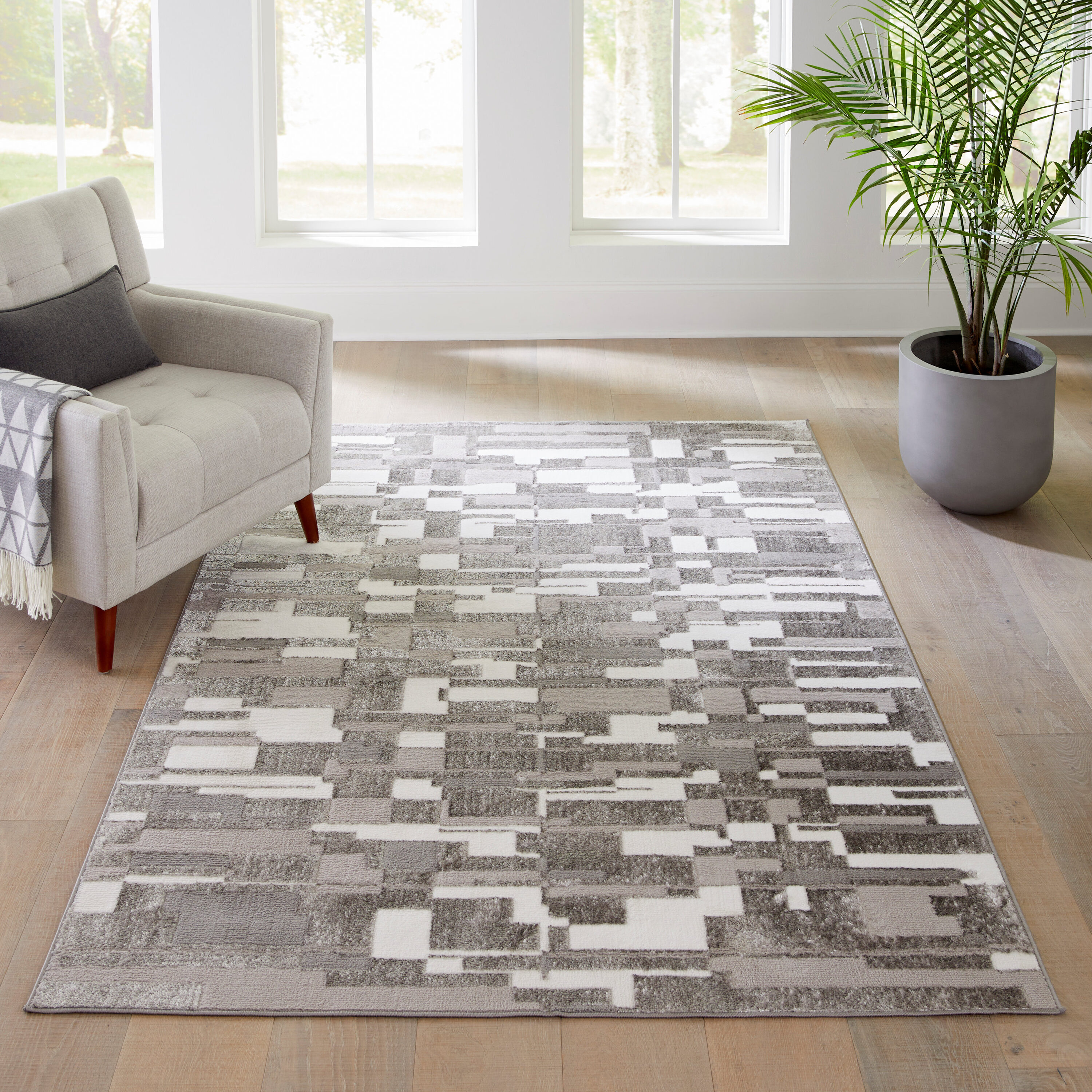 Style Selections DDU23C6L Wispy Moon 6 x 9 (ft) Loomed Polypropylene Gray Rectangular Indoor Geometric Industrial Area rug