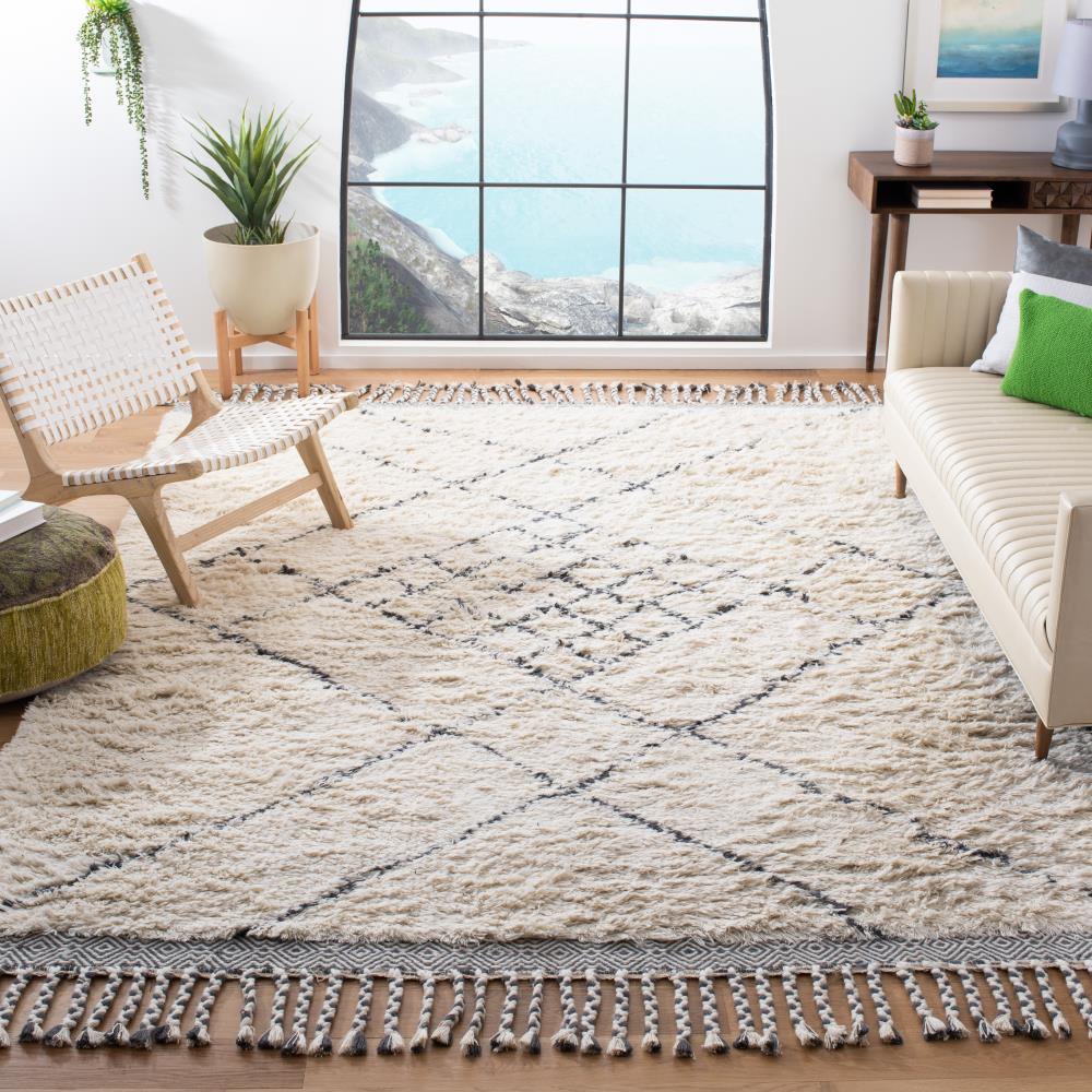 Handmade Ivory Wool Shag 5' x 8' Area Rug with Tasseled Ends