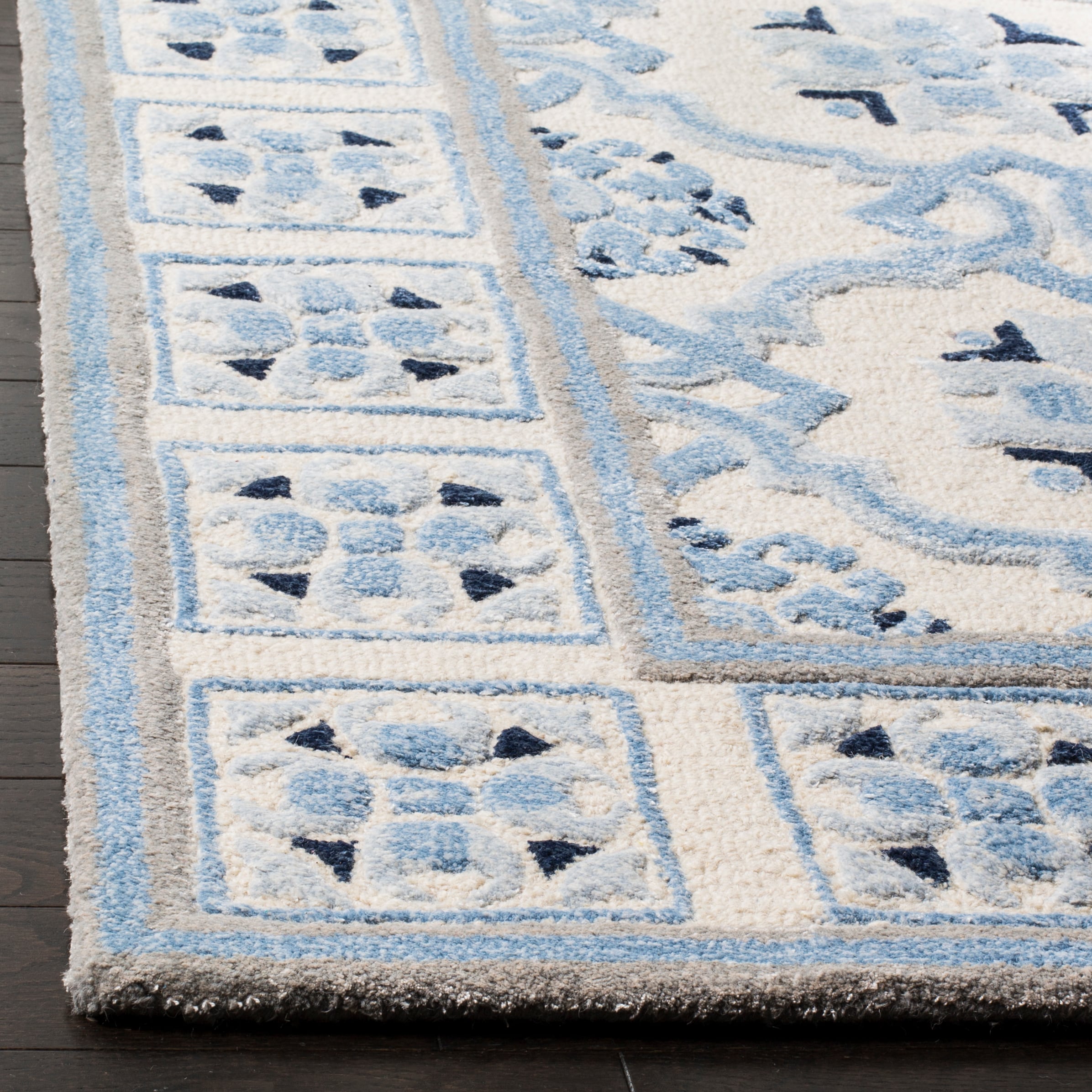Handmade Ivory and Blue Wool Viscose Tufted Area Rug