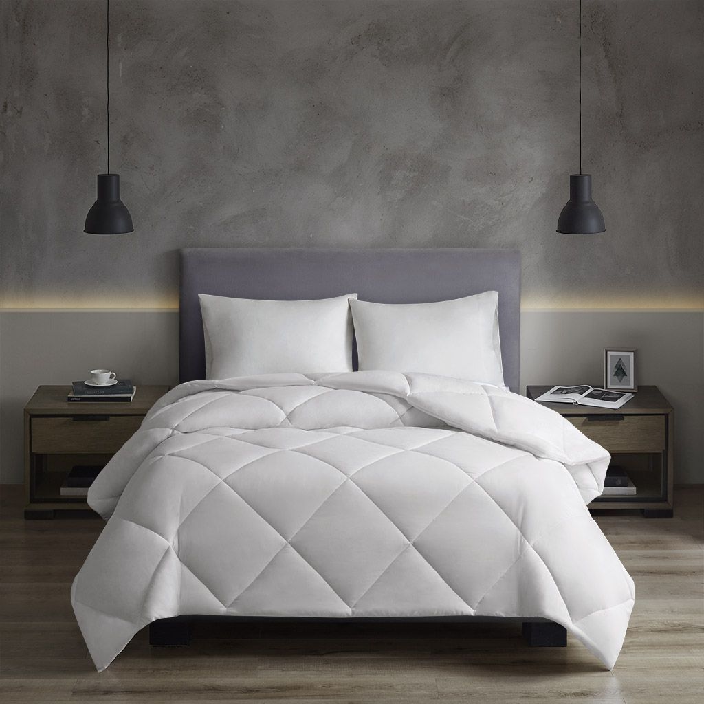 JUSHUA Oversized Down Alt Comforter with HeiQ Smart Temp Treatment is available in White and Twin and Twin XL sizes