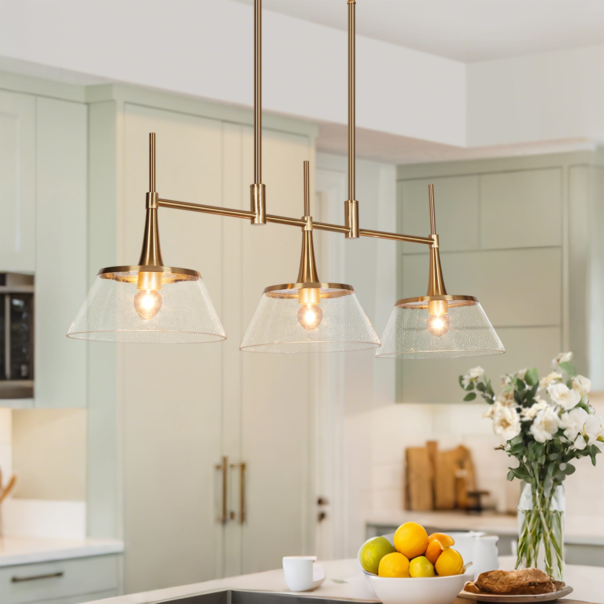 LNC LRFAJFF75C358C Quoridan 34.5-in 3 -Light Polished Gold and Clear Seeded Glass Modern/contemporary Seeded glass Linear Large Hanging Kitchen island light