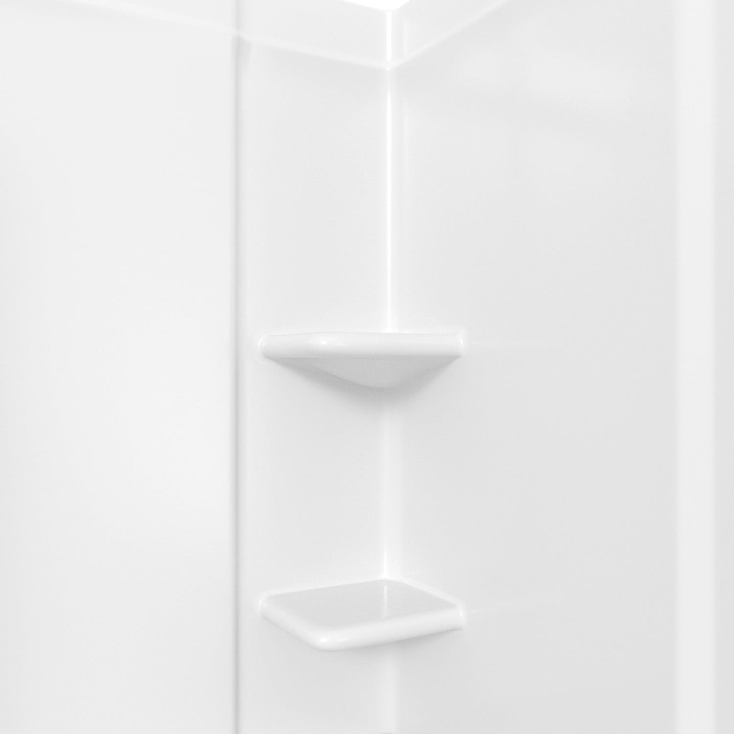 White modular shelves are mounted beside a drop-in bathtub fitted with  white horizontal surround tiles…
