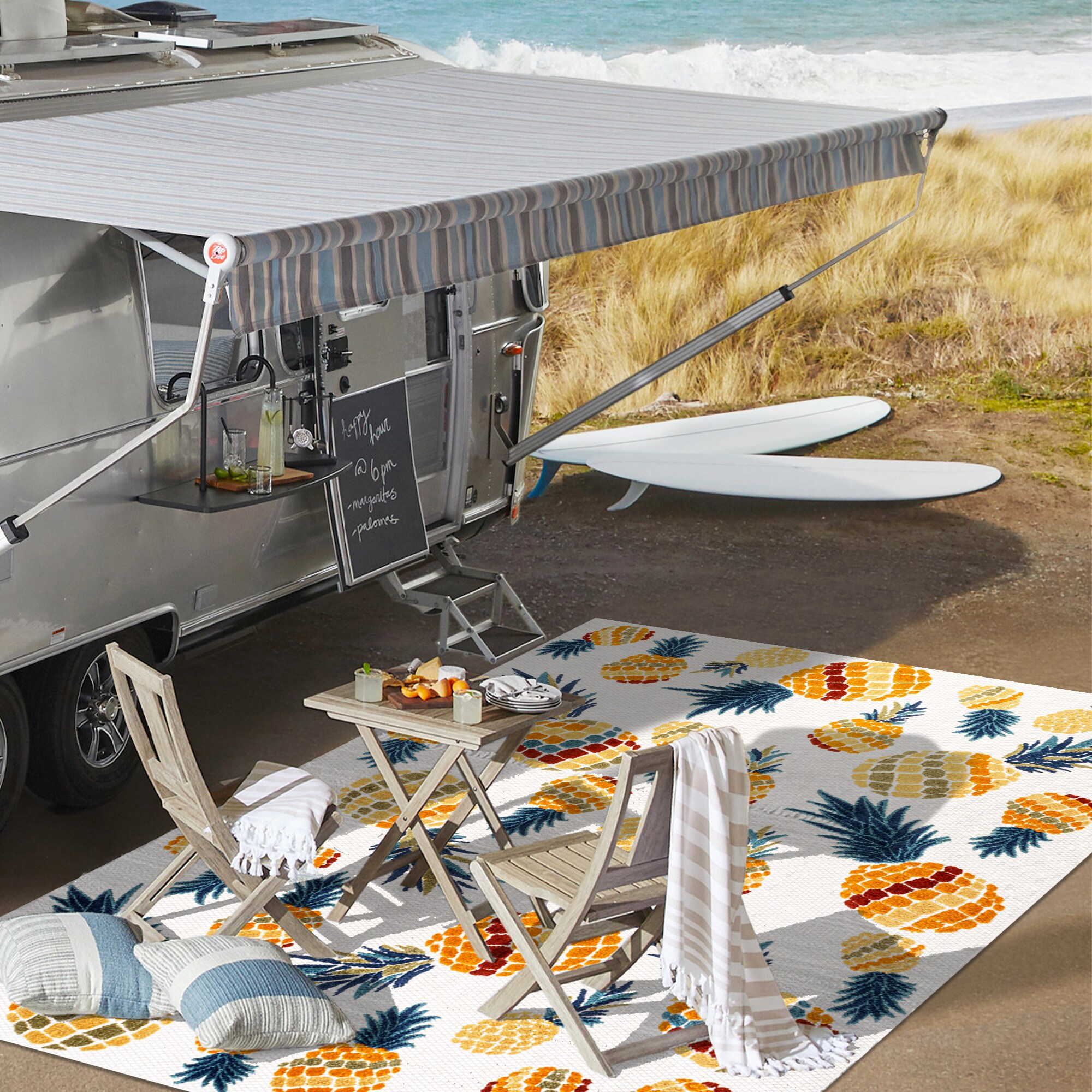 4' x 6' Ivory and Orange Floral Synthetic Area Rug