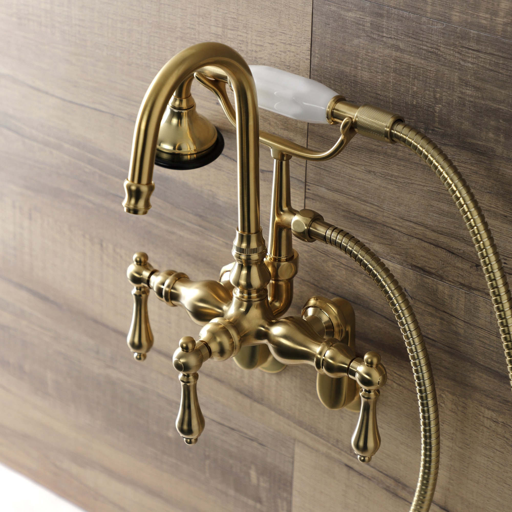 Kingston Brass WLAE301T7 Vintage Brushed brass 3-handle Wall-mount High-arc Bathtub Faucet with Hand Shower ( Valve Included )
