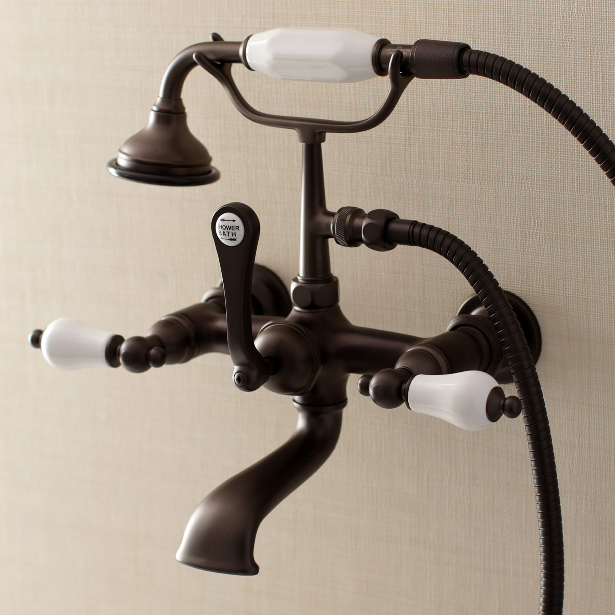 Kingston Brass WLAE553T5 Vintage Oil-rubbed bronze 3-handle Wall-mount Low-arc Bathtub Faucet with Hand Shower ( Valve Included )