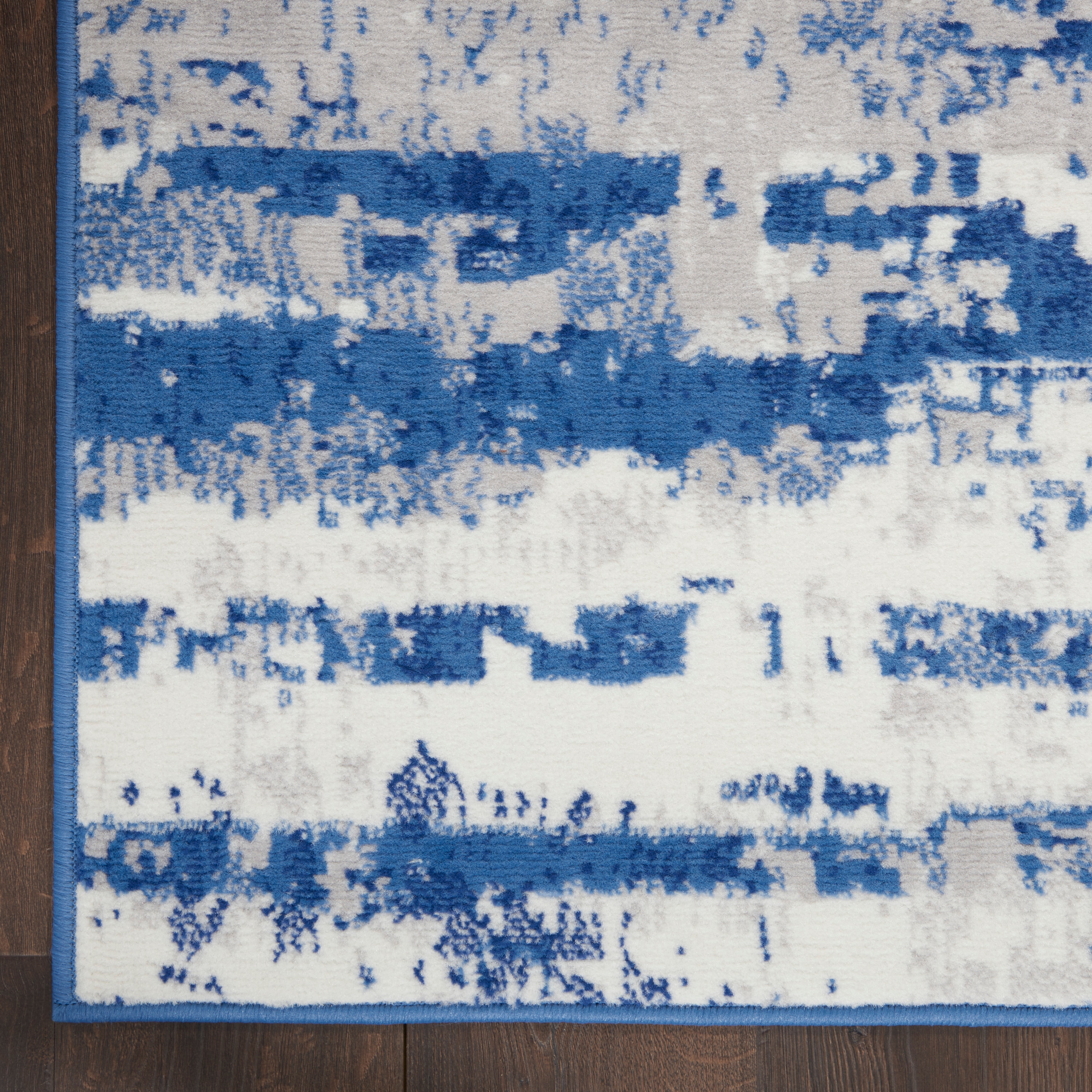 Ivory and Navy Abstract Synthetic Runner Rug