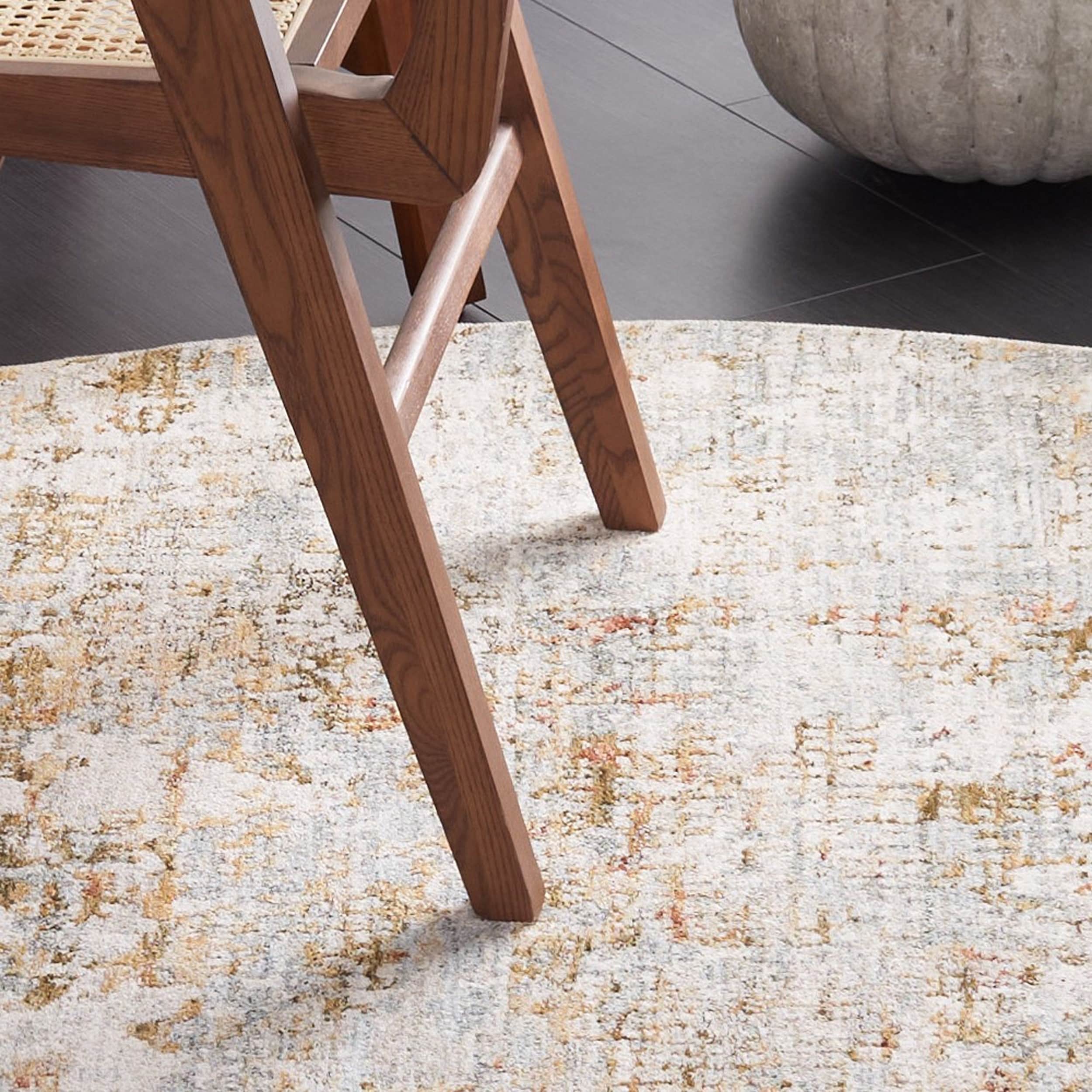 Adrianna Blue and Gold Round Synthetic Area Rug, 6'-7"