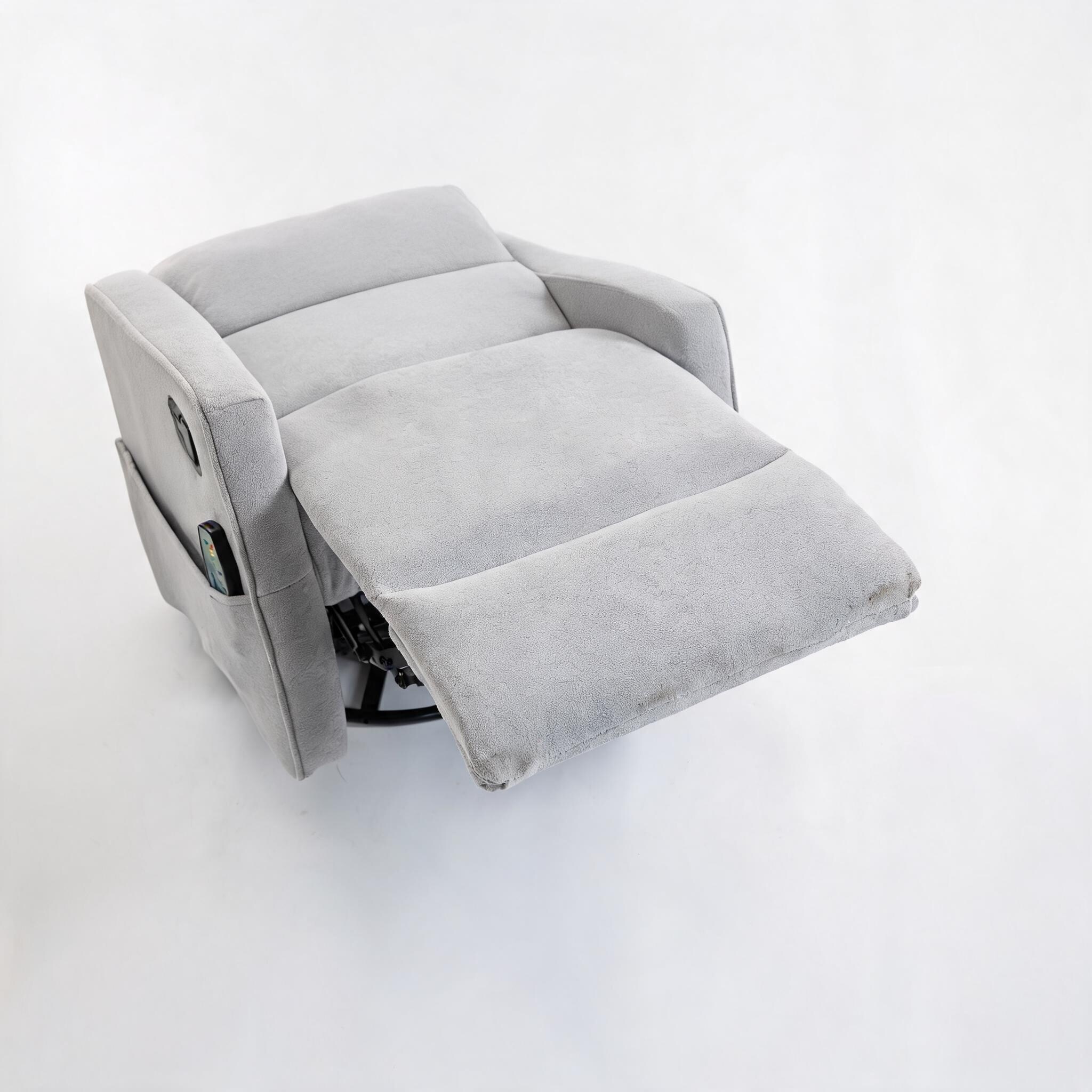 Top-down view of a grey plush velvet armchair with an extended footrest.