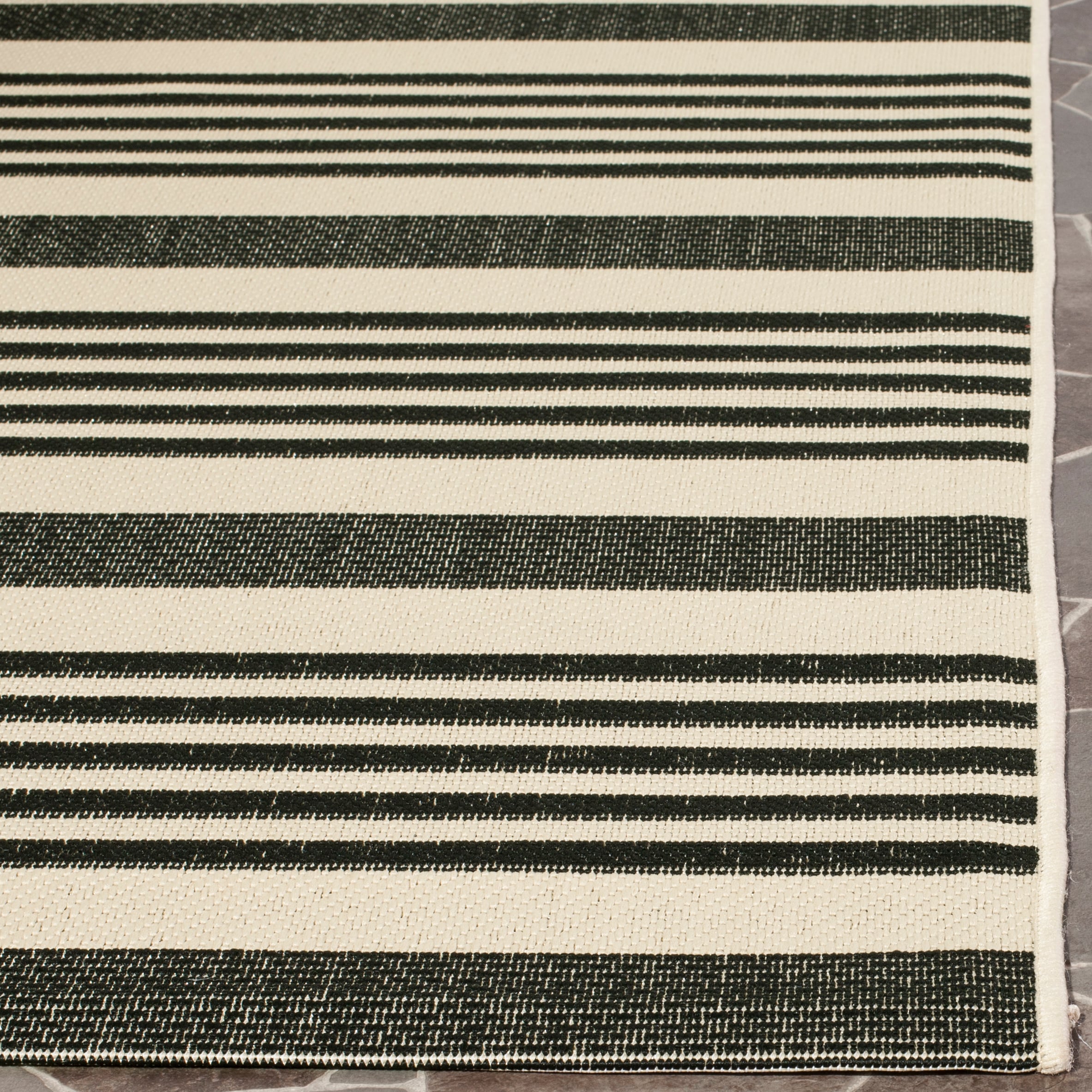 Caroline 5' x 7' Black and Beige Stripe Synthetic Area Rug